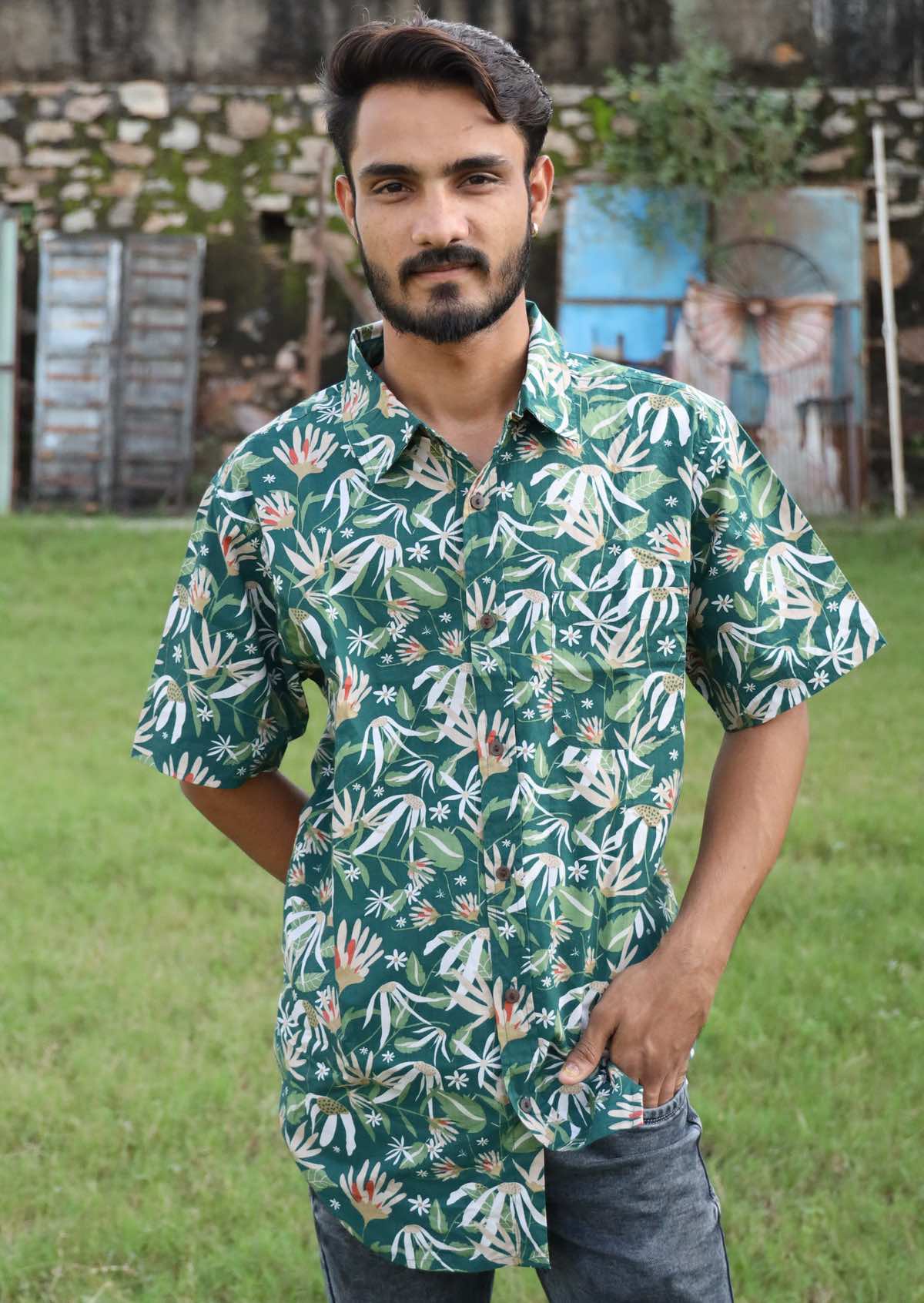 Man poses in cotton short sleeve shirt with collar and one breast pocket