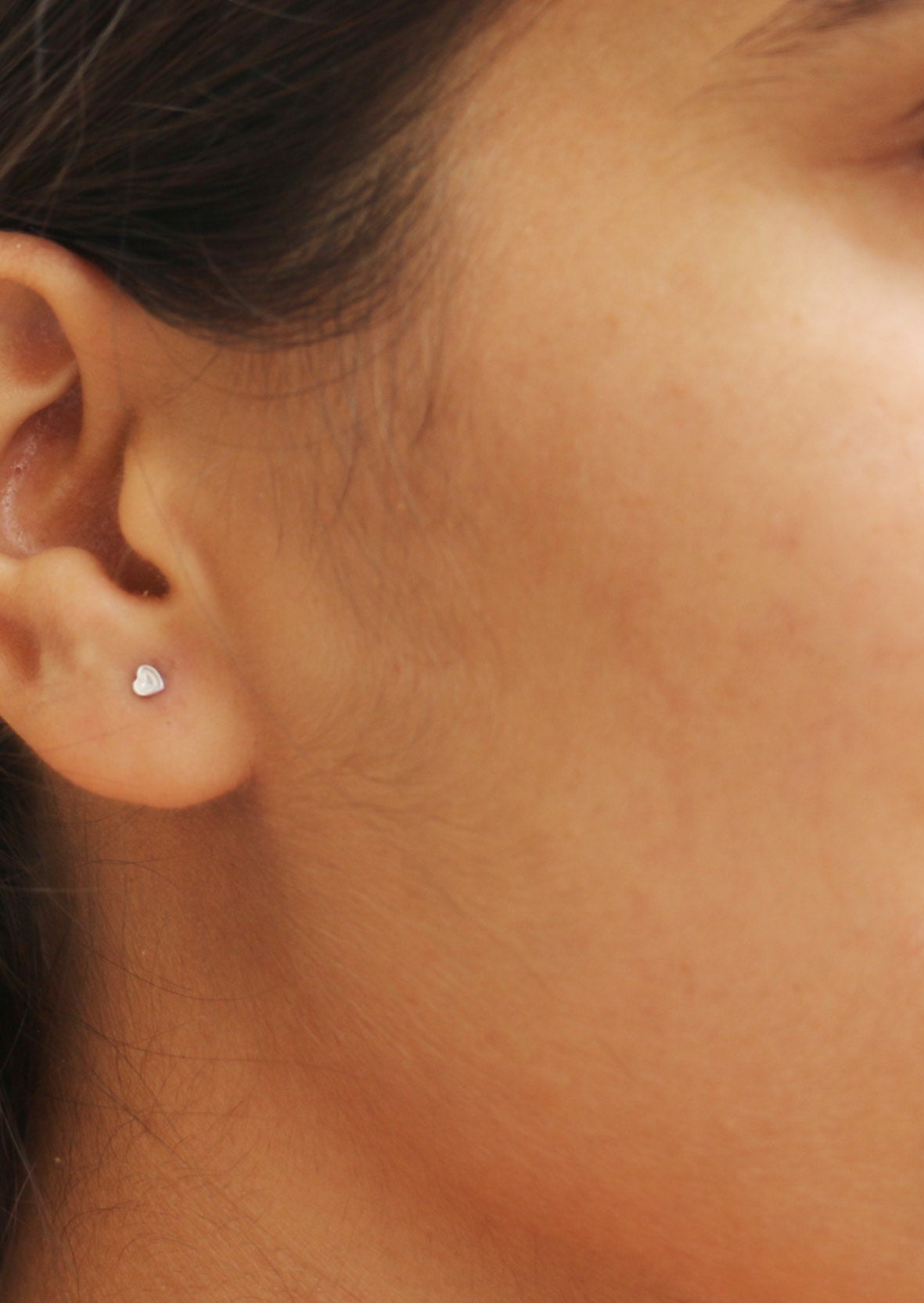 Sterling silver small heart studs with tiny heart engraved on its surface