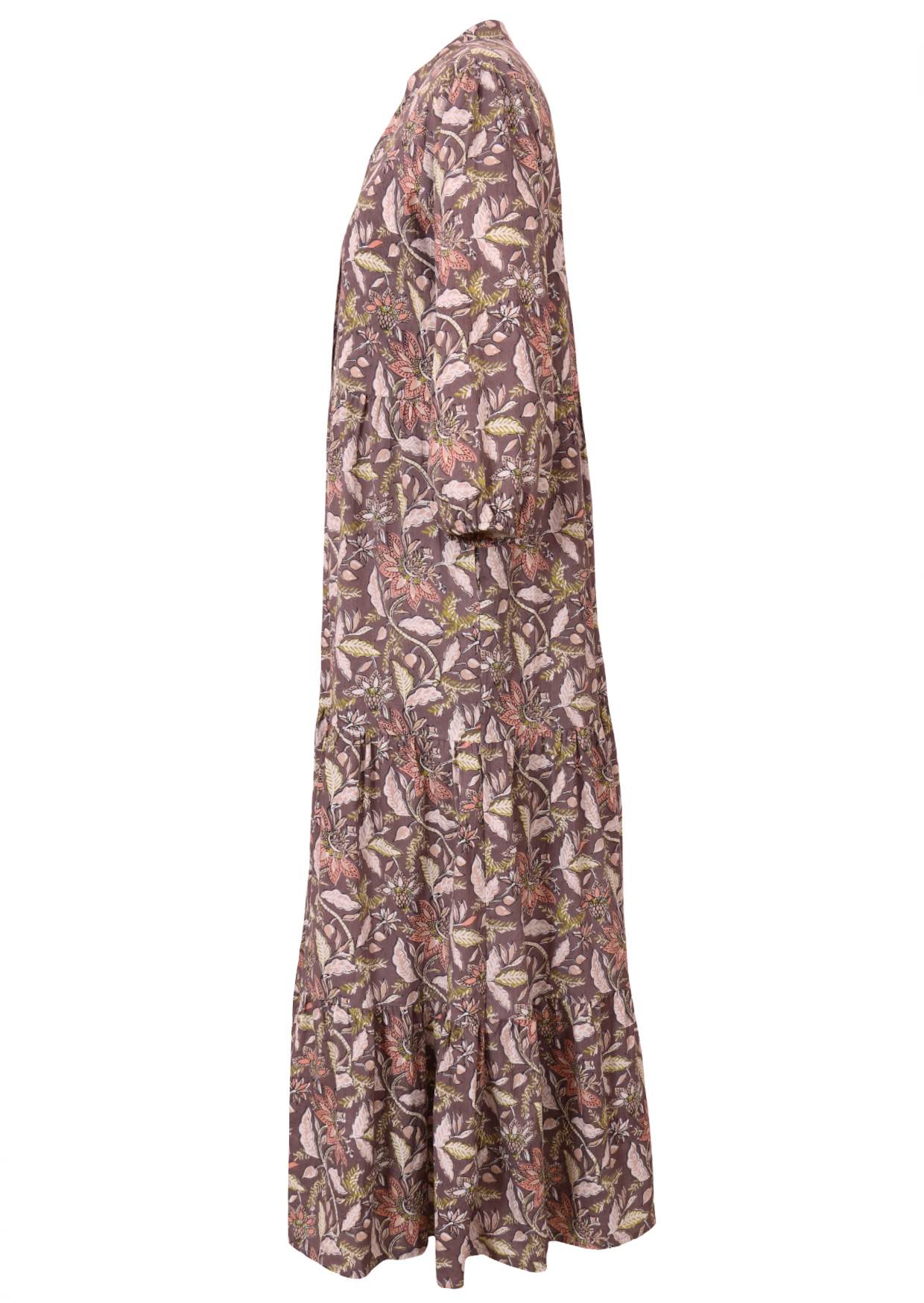 Side view of a full length maxi dress with 3 tiered flowy skirt, mandarin collar, buttoned bodice and pockets