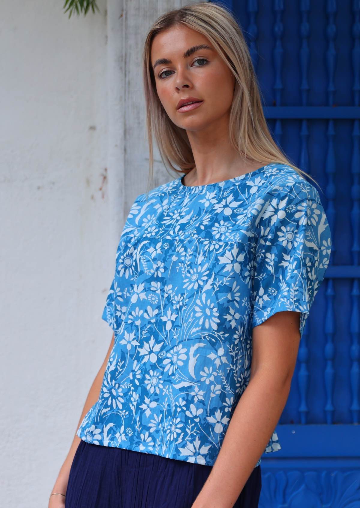 100% cotton blue floral blouse on woman with blonde hair