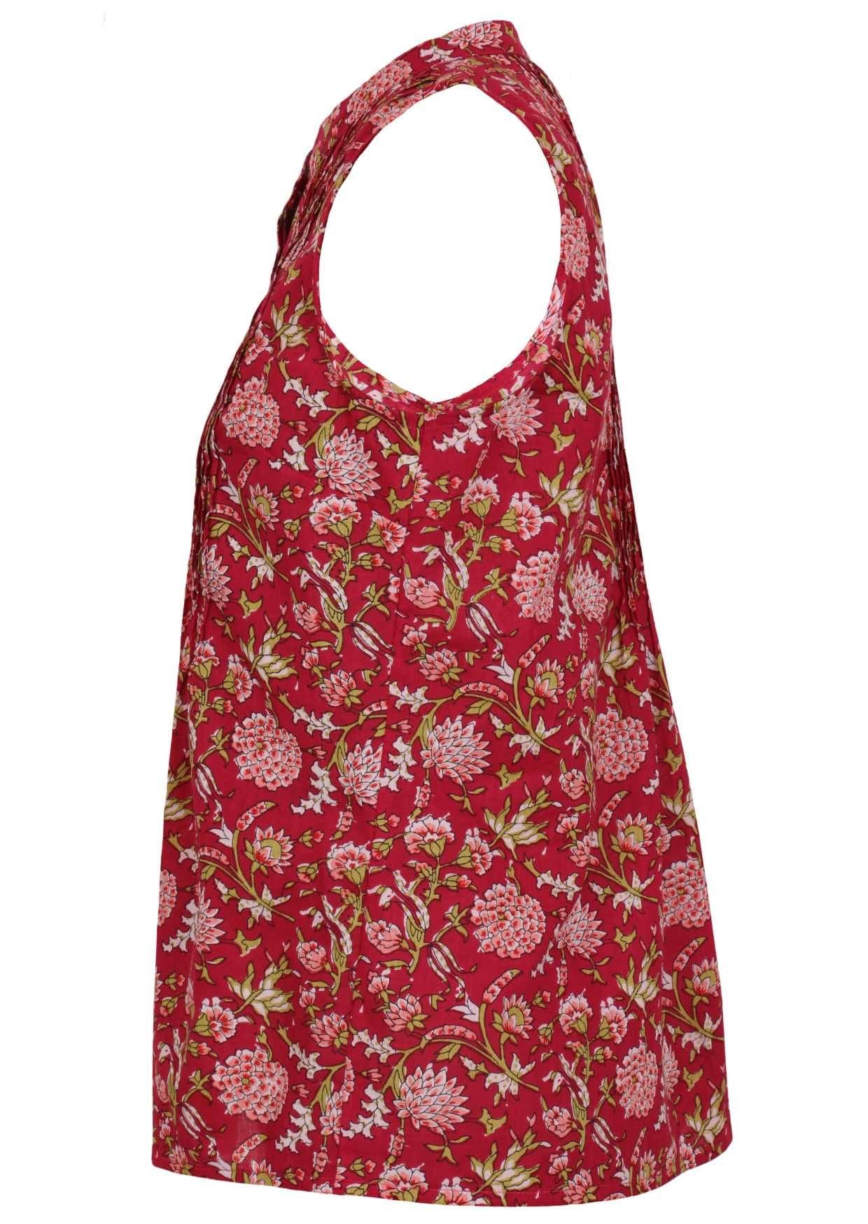 The side view of red sleeveless blouse features a repeating pattern of small pink and white flowers with green stems and leaves