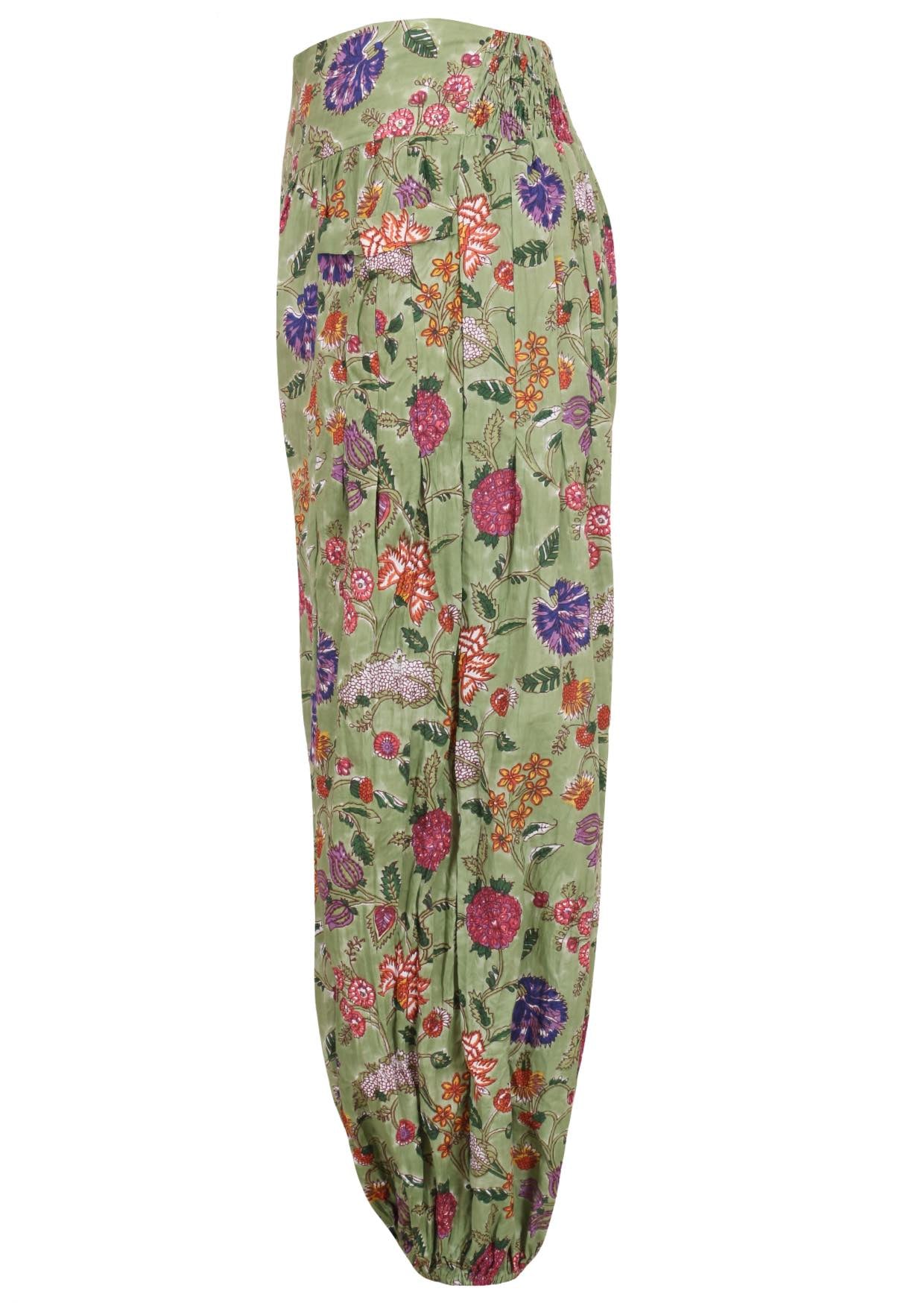 Green based multi-coloured floral print harem cotton pants with buttoned ankles.