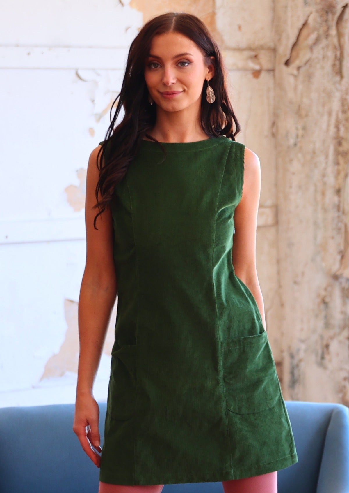 Woman wearing green corduroy tunic