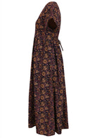 Side image of dark purple relaxed fit cotton dress with a shoestring side tie.