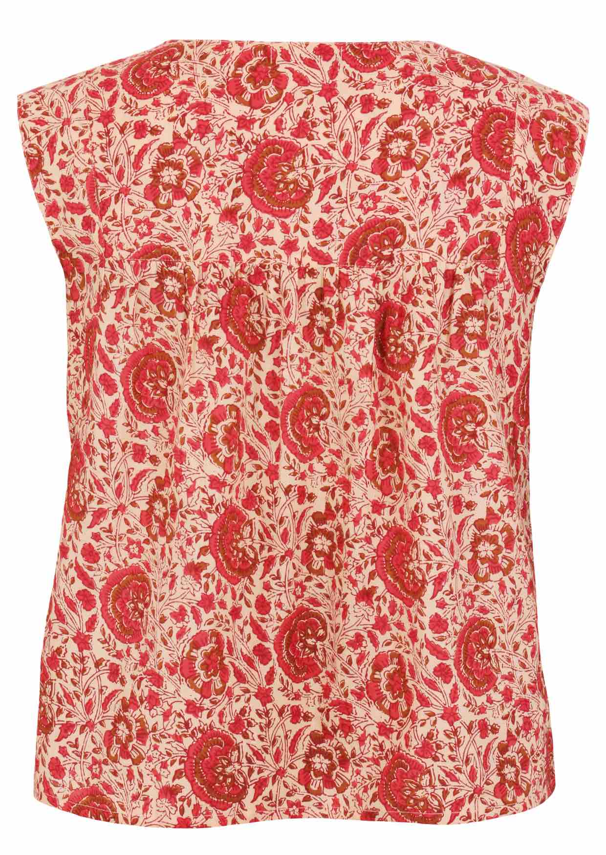 Cap sleeves top with cream based warm floral print on a white background.