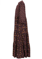 Side image of two toned floral maxi dress in dark purple with 3/4 sleeves and pockets.