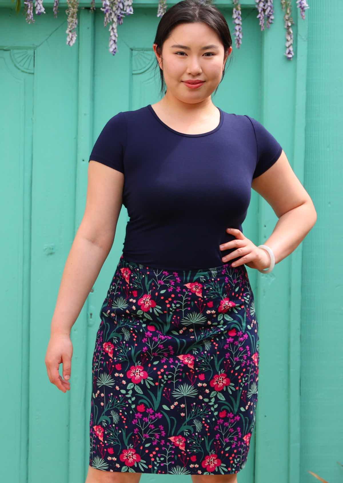 Model wear bold purple floral print cotton  reversible skirt 100 percent cotton mid length