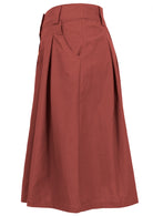 Cotton knee length skirt in burnt henna with belt loops, box pleats and pockets