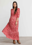 Woman swishes skirt of rayon maxi dress with 3/4 sleeves and elastic ruched waistline
