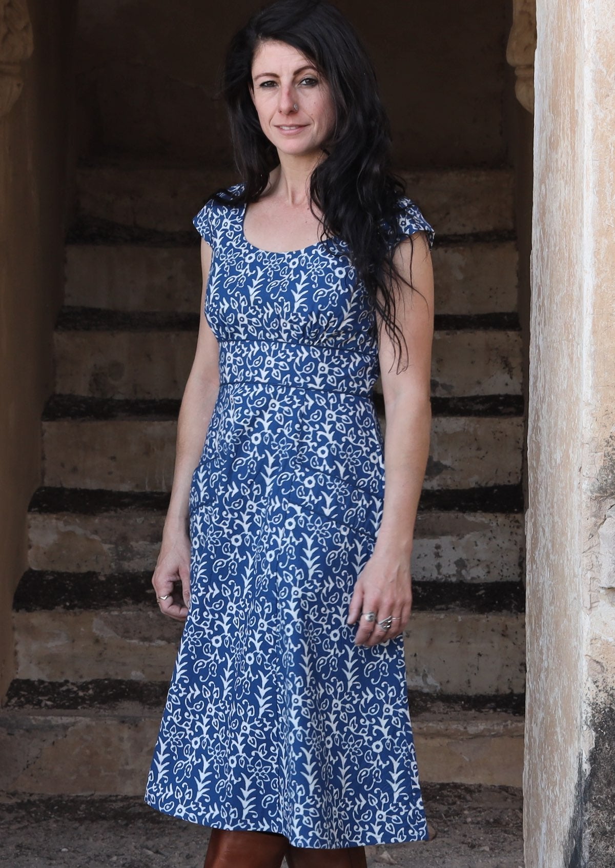 Model wearing blue 100 percent cotton scoop neck retro dress