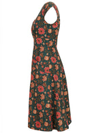 100% cotton dress in dark green based floral print with cap sleeves, piped details and pockets.