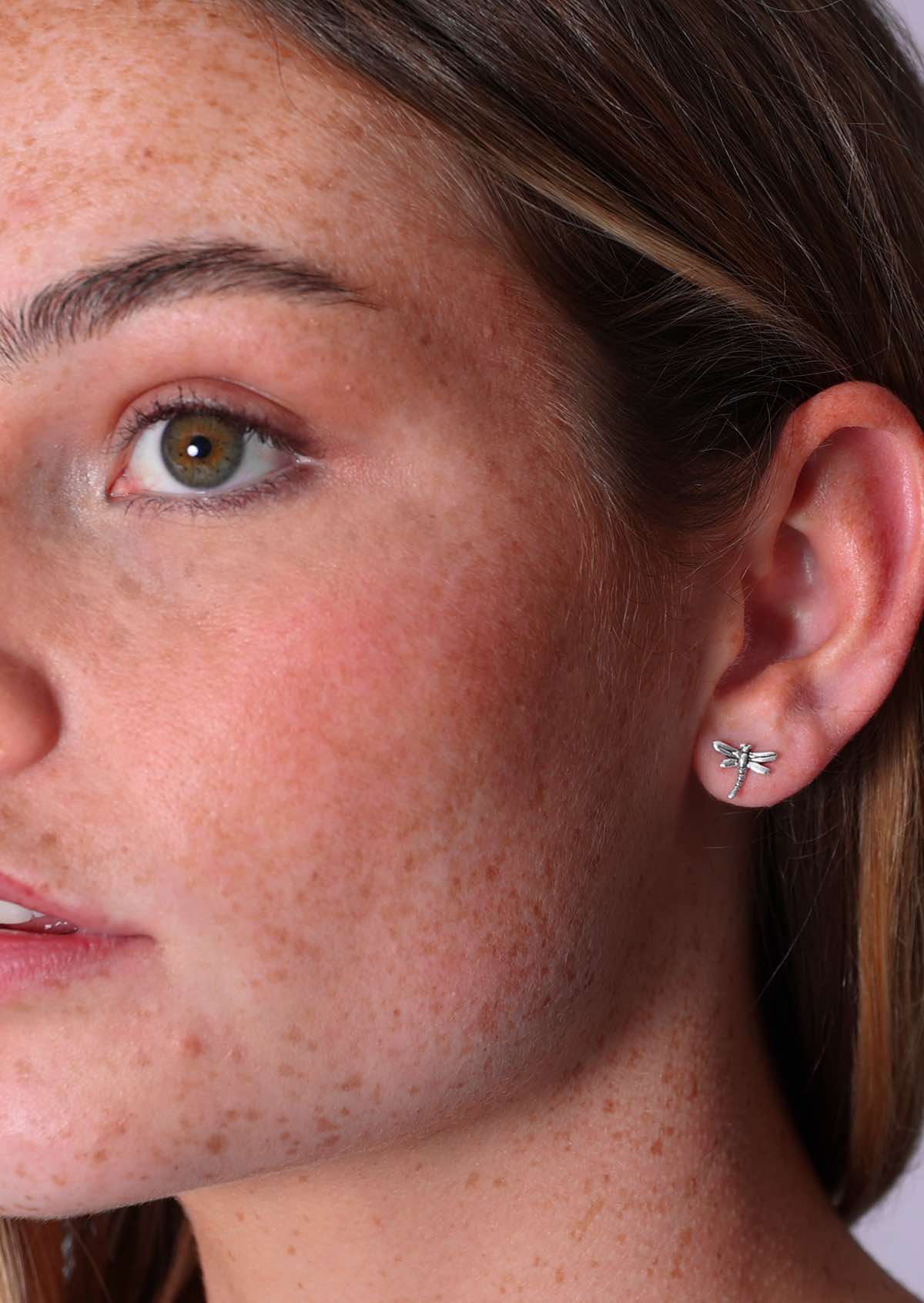 Model wears small sterling silver dragonfly studs