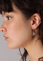 Sterling silver cutout lotus flower motif hook earrings