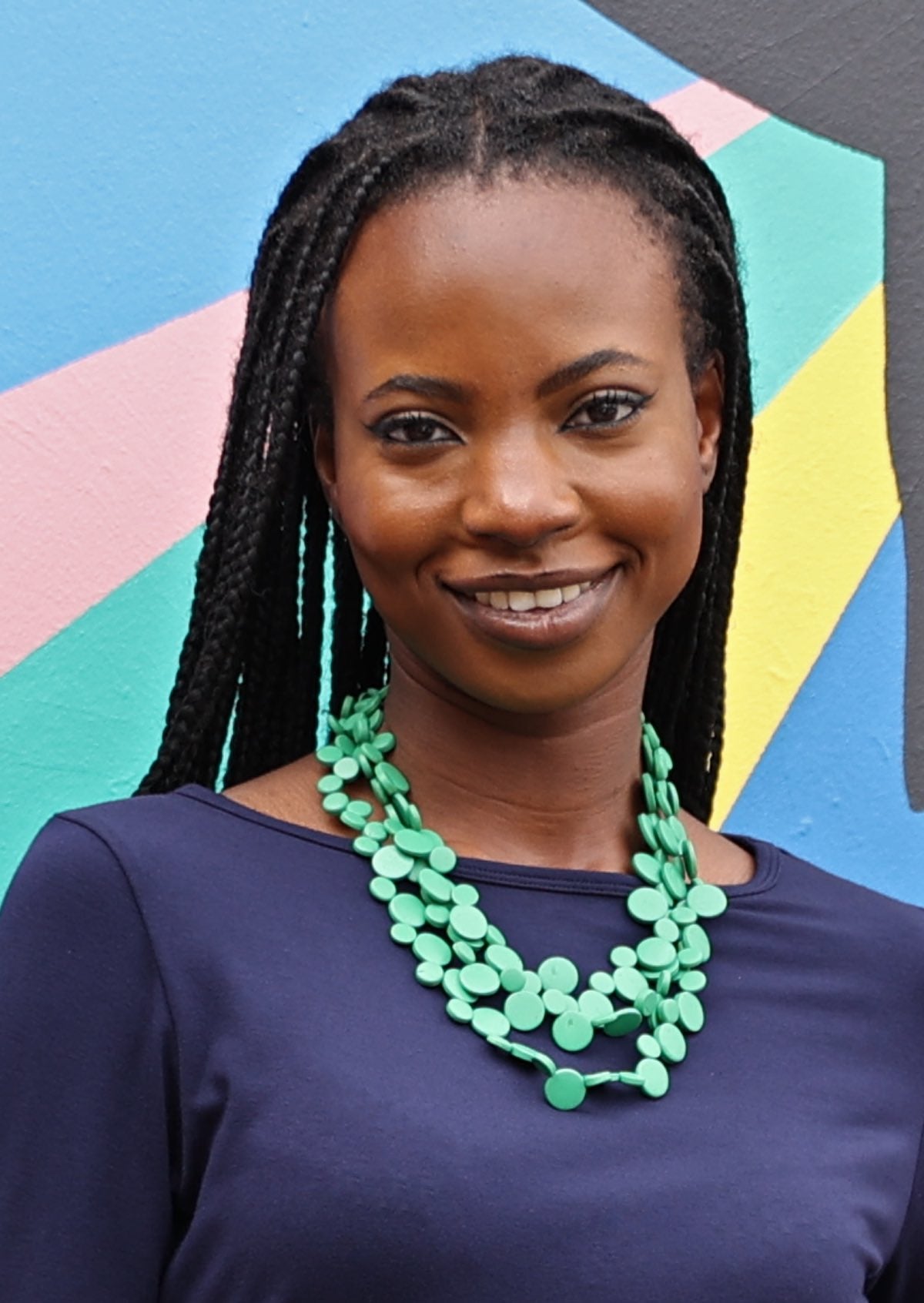 Three strands of flat round wooden beads in spearmint green