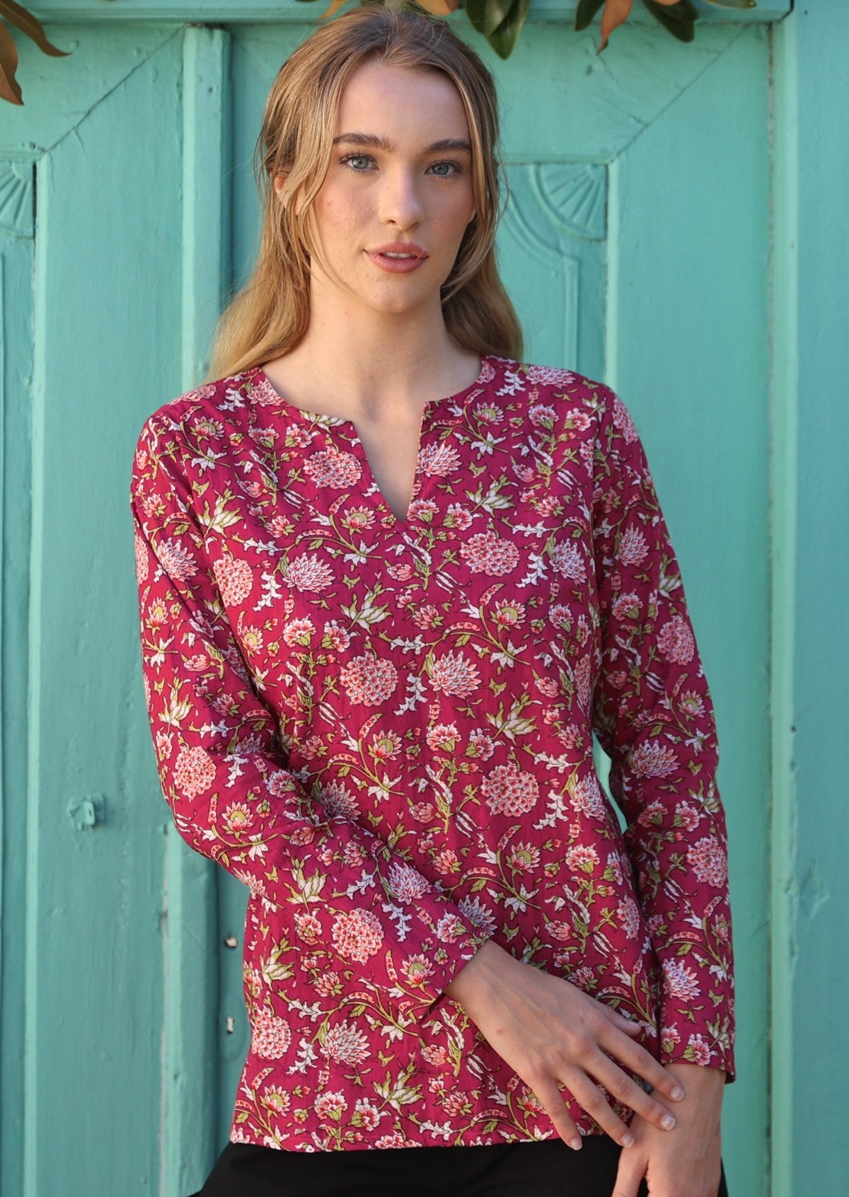100% cotton cranberry based floral print long sleeve top with V cutout neckline.