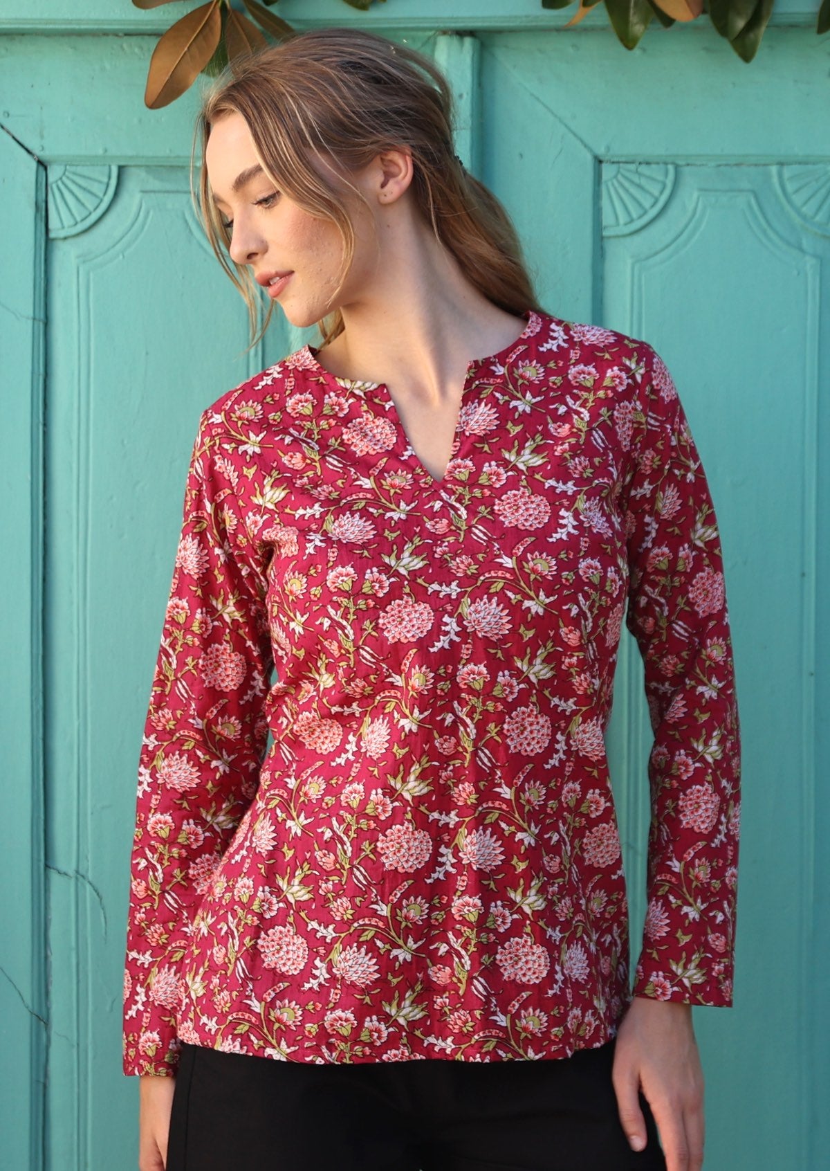 Long line cotton top with long sleeves and V cutout at the neckline.