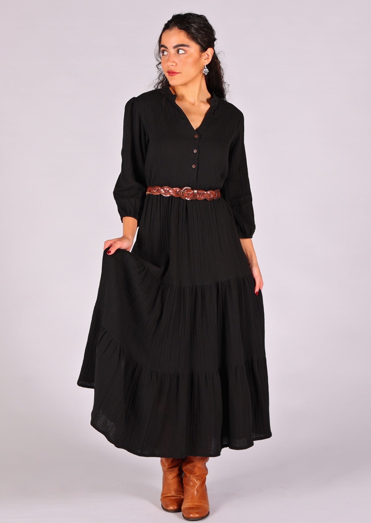 Model wears gorgeous double cotton boho tiered maxi dress with belt cinching the waist