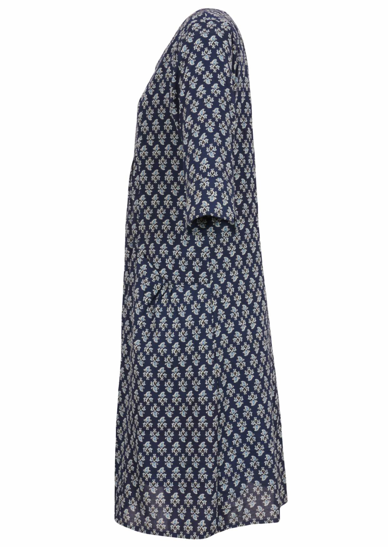 Side view of relaxed fit below knee length cotton dress with 3/4 sleeves, pockets and round neckline.