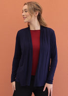 Model wears soft stretch rayon cardi navy blue with open front and full long sleeves.