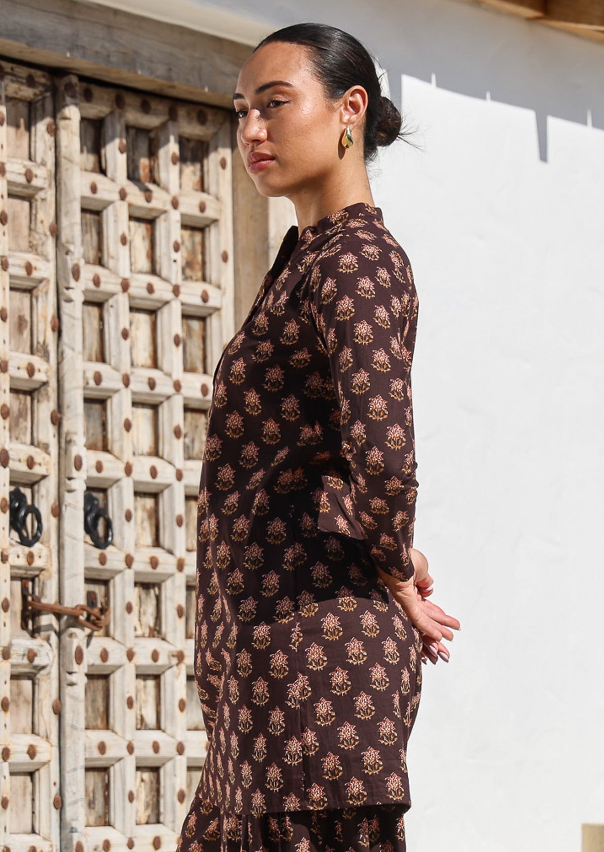 100% cotton long sleeved tunic with mandarin collar, V neckline and brown based floral pattern.