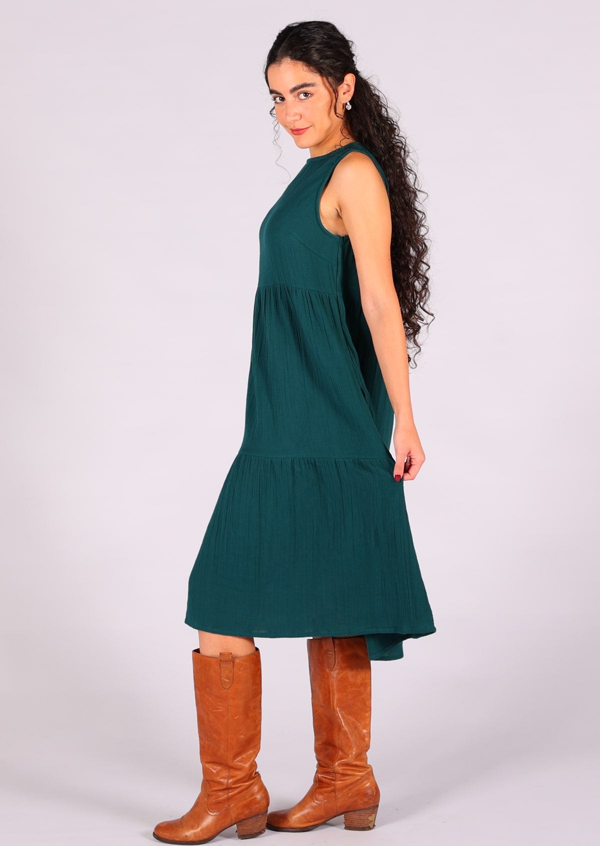 Gorgeous deep teal sleeveless dress with high neckline and hidden side pockets
