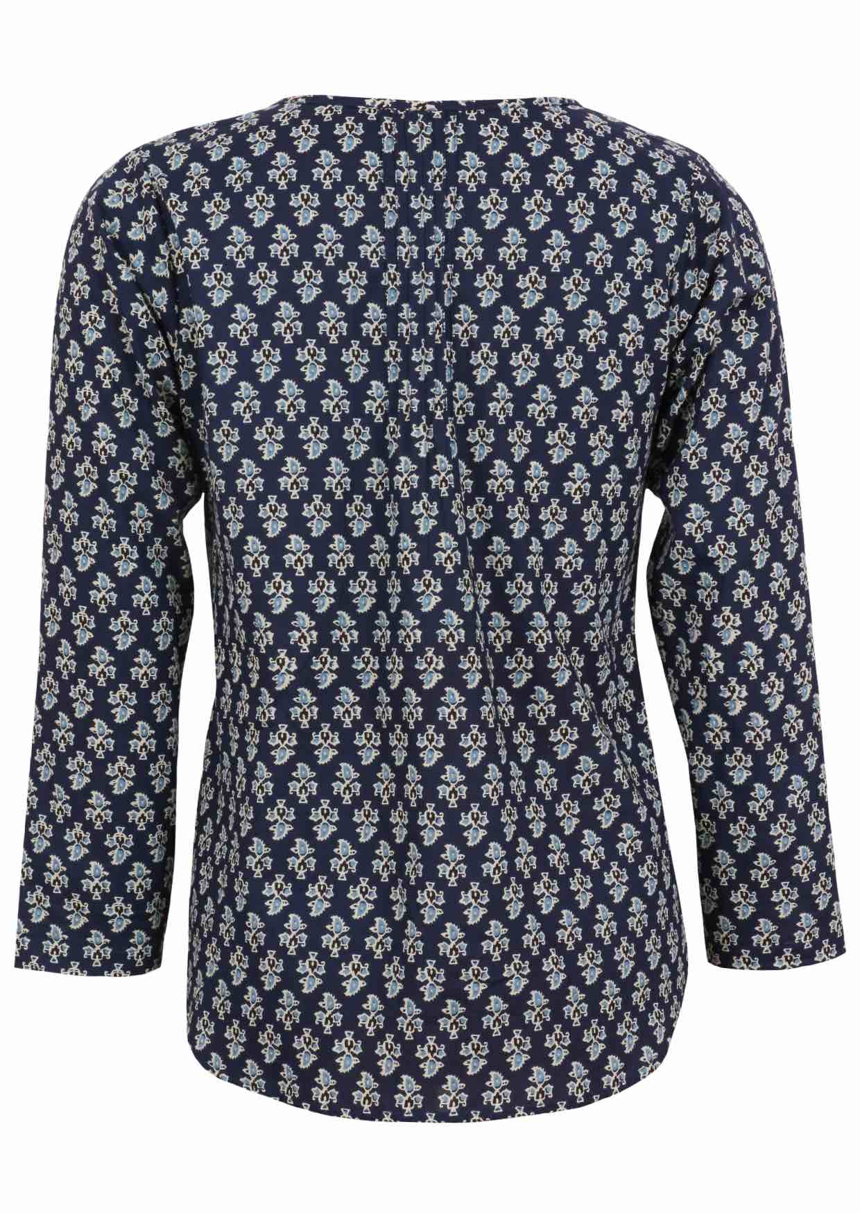Back image of long sleeve cotton top with navy blue based floral print.