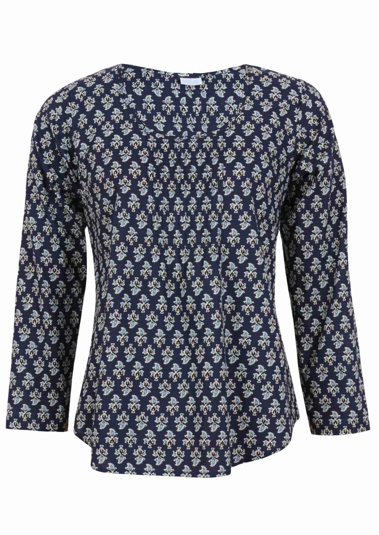 Lightweight 100% cotton top showcasing a simple round neckline, long sleeves and pleats across the bodice.