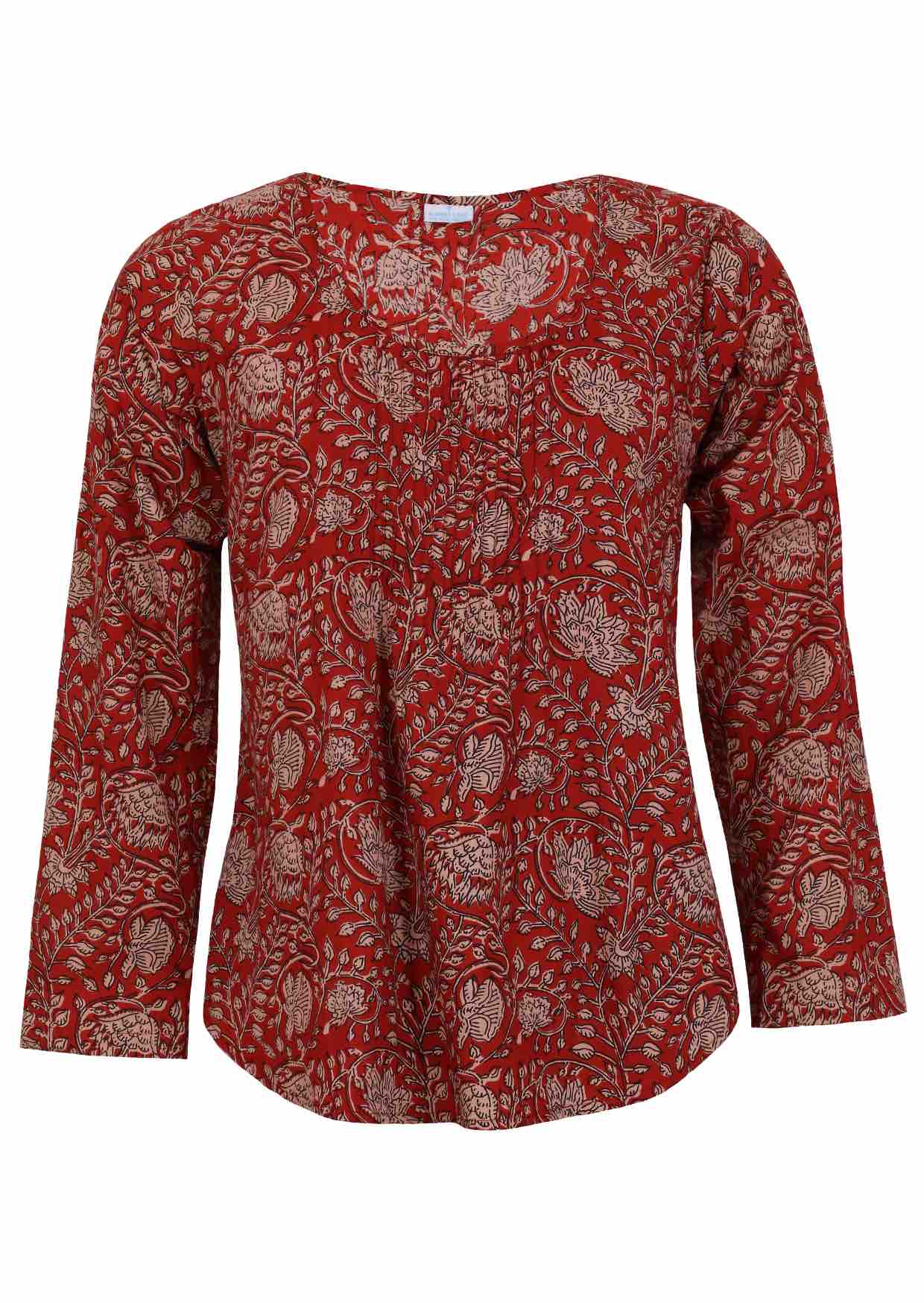 Lightweight 100% cotton top showcasing a simple round neckline, long sleeves and pleats across the bodice.