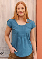 Model wears 100% cotton blue, short sleeve top.