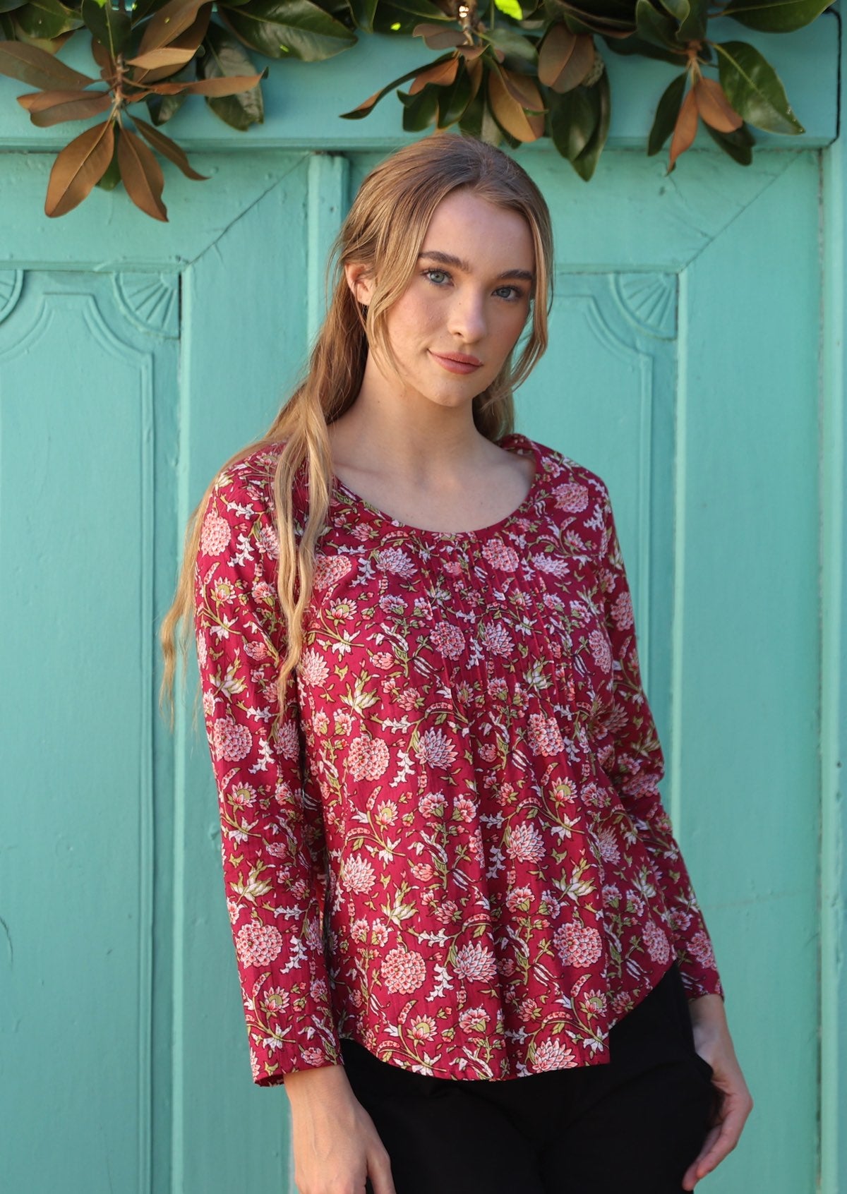 100% cotton long sleeve top with tiny pleated details and round neck.