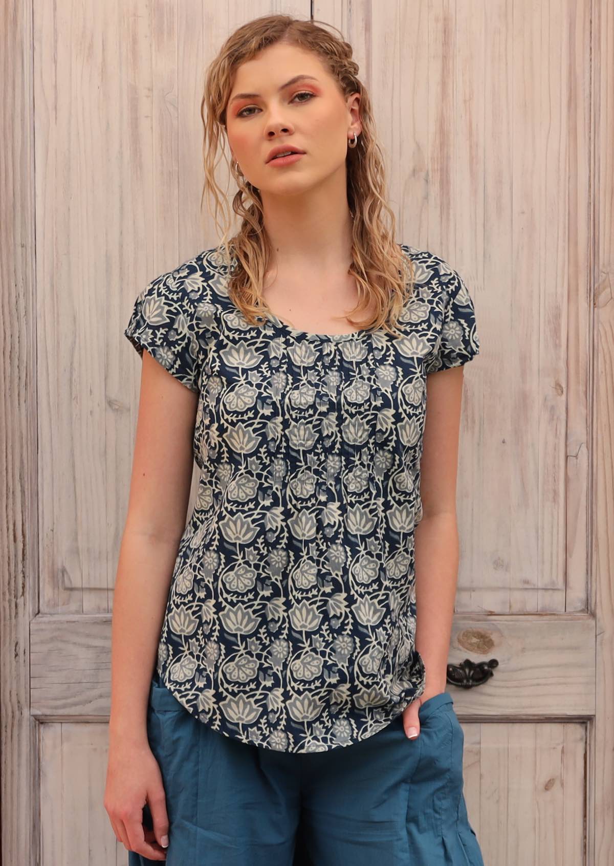 Model wears 100% cotton top with cap sleeves.