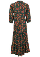 Back image of 100% cotton maxi dress featuring 3/4 sleeves and dark green base with orange floral print on it.