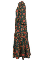 Side mannequin photo of a full length maxi  dress with 3 tiers, collar and buttoned bodice.