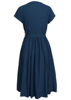 Navy blue retro cotton dress with cap sleeves and small pleats at center of waist