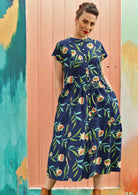 Model wears a dress with a mandarin collar.