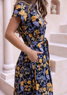 100% cotton retro floral dress with fabric tie and pockets.