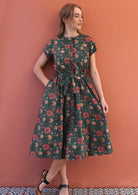 100% cotton above knee length cotton dress with pockets and ajustable waistband.