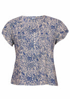 White based blue floral print cotton top with coconut buttons.