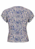 White based blue floral print cotton top on a white background.