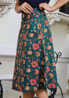 Side pose of model in A line cotton skirt with pocket and hidden side zip.