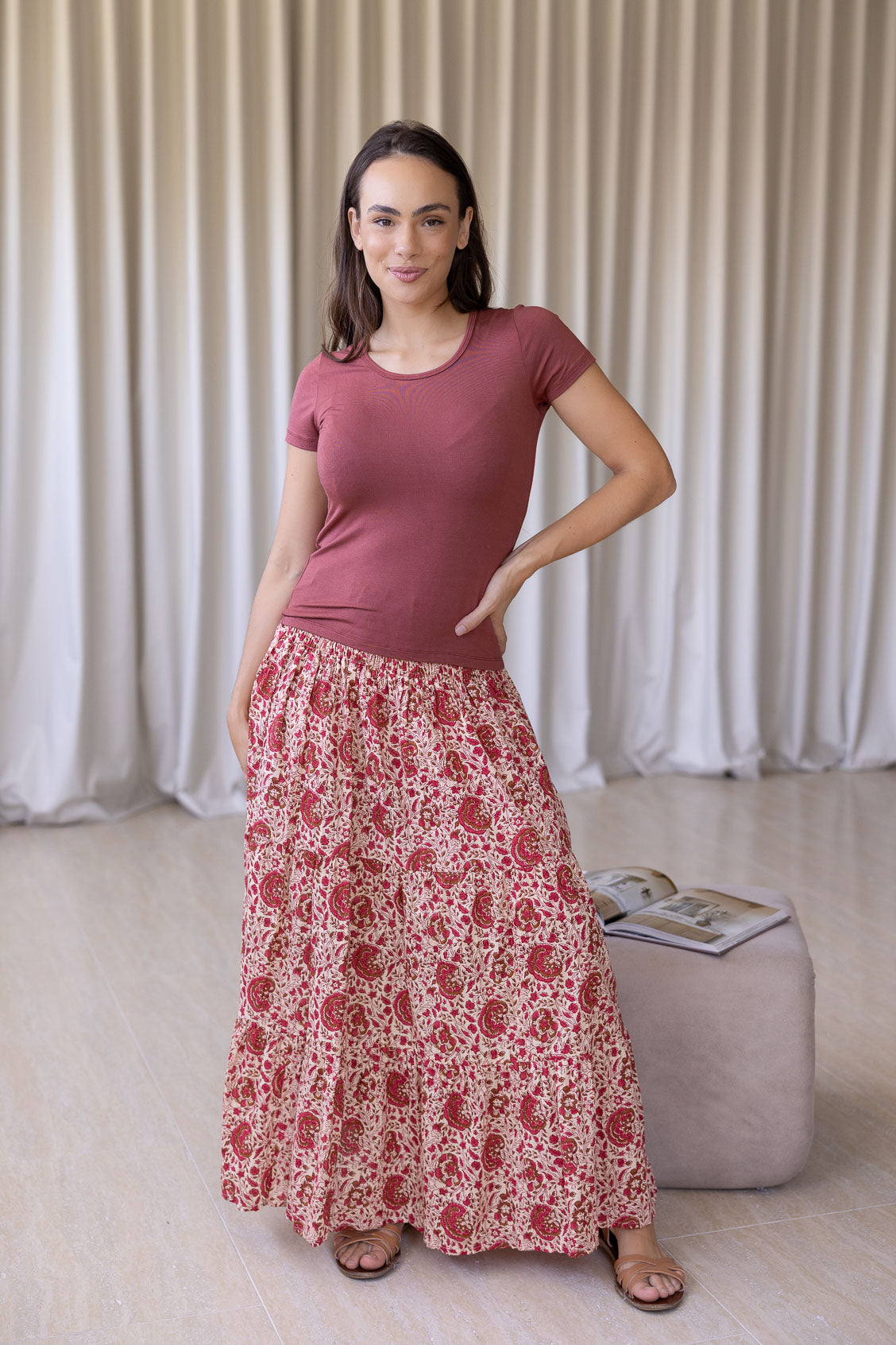 woman wearing a simple pink top and 100% cotton maxi skirt in gentle cream based floral print