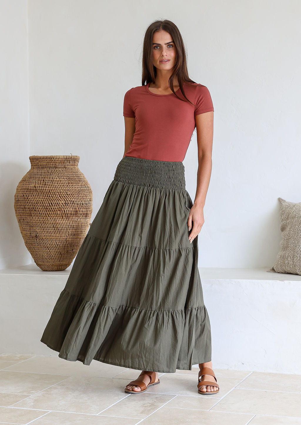 Model flaunting olive green shade cotton maxi skirt with a wide shirred elastic waistband.