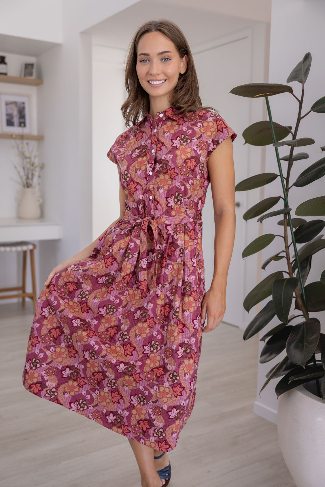 Model posing in a Japanese style floral print shirt style 100% cotton dress with cap sleeves and detachable waist tie