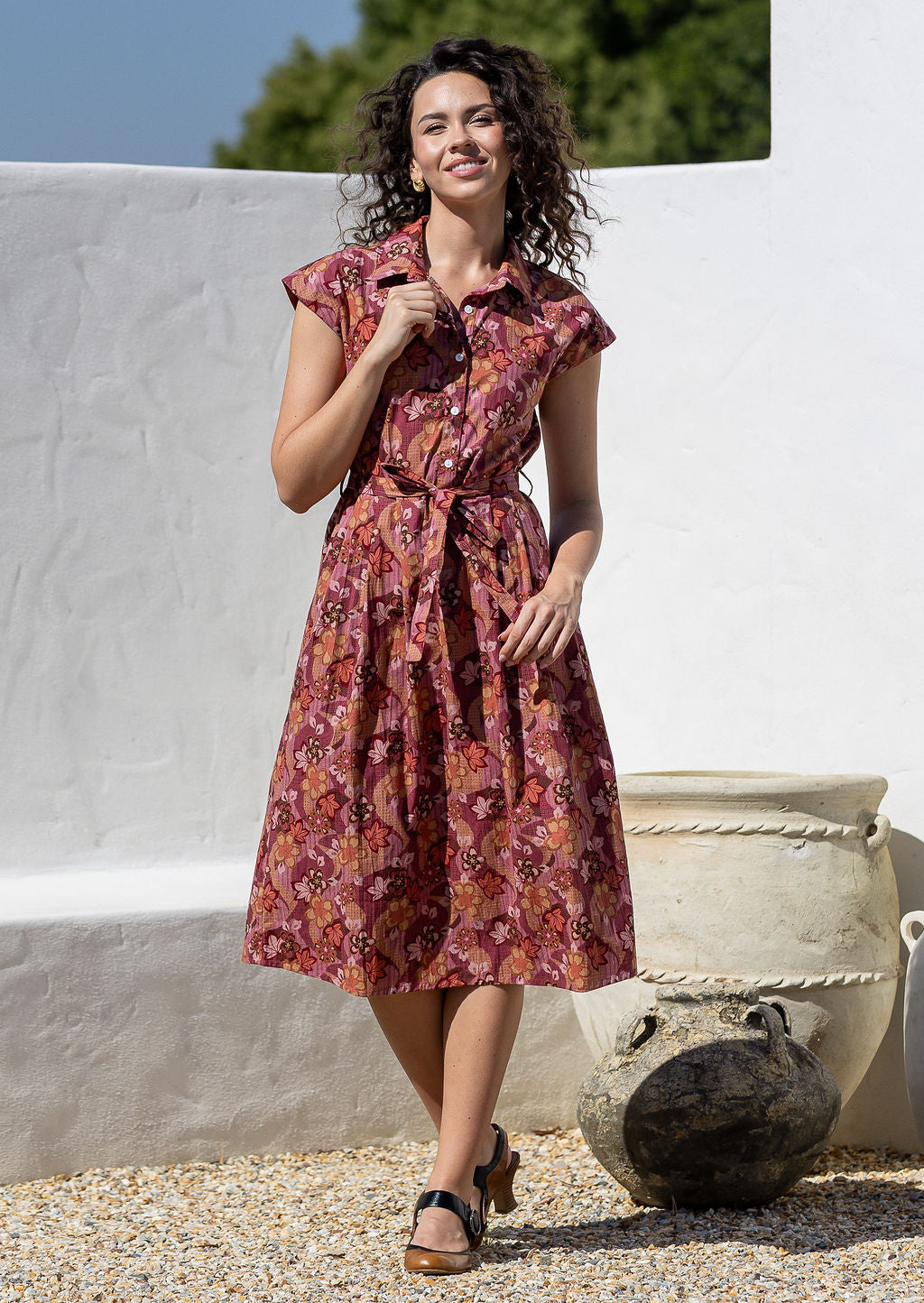 Model posing in a Japanese style floral print shirt style 100% cotton dress with cap sleeves and detachable waist tie