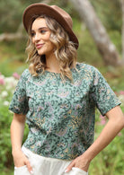 Cotton short sleeve top in sage green with seam across the front of bust.