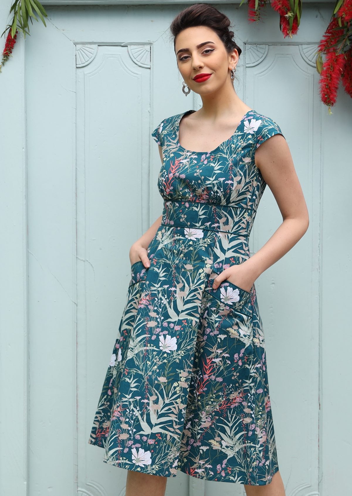 1950s Inspired Swing Womens Dress tailored bodice cap sleeve scoop neckline empire waistband flared a-line skirt below the knee length with pockets 100% cotton blue and grey toned floral print with pink | Karma East Australia