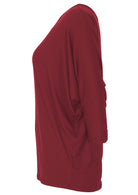 Side view of loose fitted maroon women's rayon top