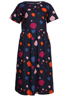 100% cotton relaxed fit dress has irregular colorful spot print on navy blue base.
