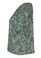 Side view of relaxed fit cotton top with round neckline and short sleeves.