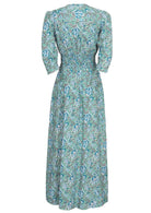 Rayon maxi dress with 3/4 sleeves and ruched waistband in blue floral print.
